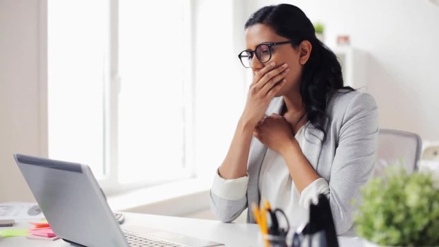 stressed businesswoman with laptop at office