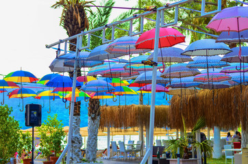 Multi-colored umbrellas are used on rest as a roof from the sun