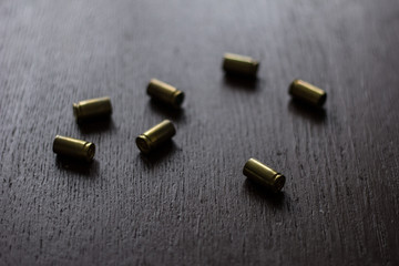 Cartridges on the dark wooden table