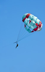 Couple flys on a parachute