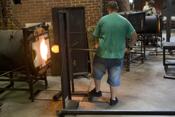 Fototapeta na wymiar Glass furnace. Glass Blower at Work