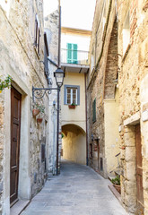 alley street in the village of Capalbio, tuscany, italy