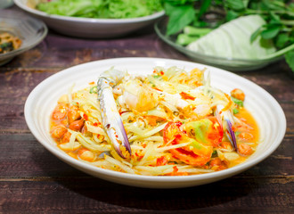 Thai traditional food papaya salad with raw crab