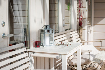 Terrace lounge with comfortable divans in a luxury house. garden furniture at the patio. Architecture modern design, veranda of modern house.Photo of relaxing area outside of mansion