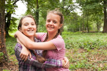 Fototapeta premium Two sisters hugs