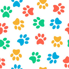 Seamless colorful animal paw pattern on white background © tereez
