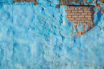 Torn brick blue wall background