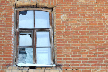 The old broken window in an abandoned house