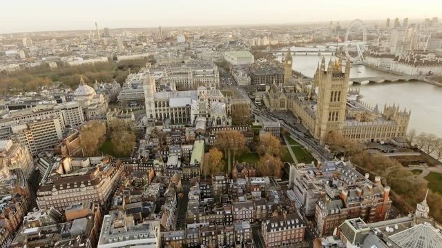 4K Aerial Flight Orbiting Big Ben aka City of Westminster in London, England UK at Dawn Time Early Morning with Beautiful Sunrise in Autumn