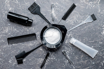 hairdresser woorking desk with tools on gray background top view