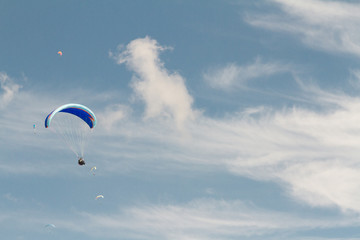 A paraglider up in the sky