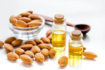 cosmetic and therapeutic almond oil on white background