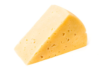 A piece of fresh cheese on white