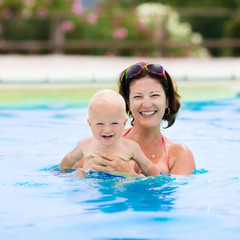 Mother and baby in swimming pool