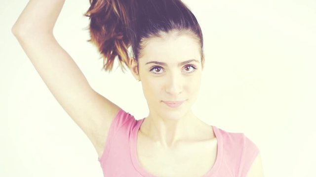 Woman undoing ponytail long hair funny