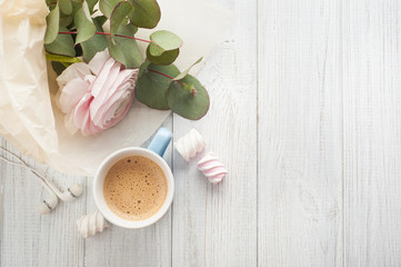 Bouquet, flower, cup of coffee, earphones.