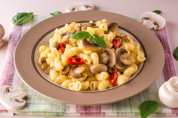Pasta with mushrooms, chili and basil.