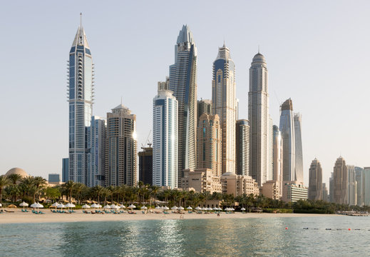 Dubai Marina tall skyscrapers in a bright warm evening