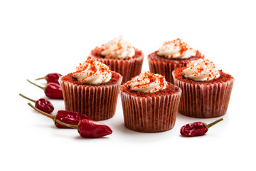 Chocolate  cupcakes with red hot chili pepper isolated on white