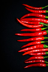 Red chili peppers on black background, Fresh hot chili peppers.