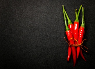 Red chili peppers on black background, Fresh hot chili peppers.