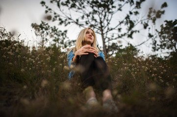 Young cute lady in jeans jacket outdoors portrait in abandoned place