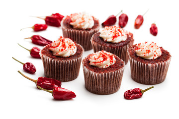 Chocolate  cupcakes with red hot chili pepper isolated on white
