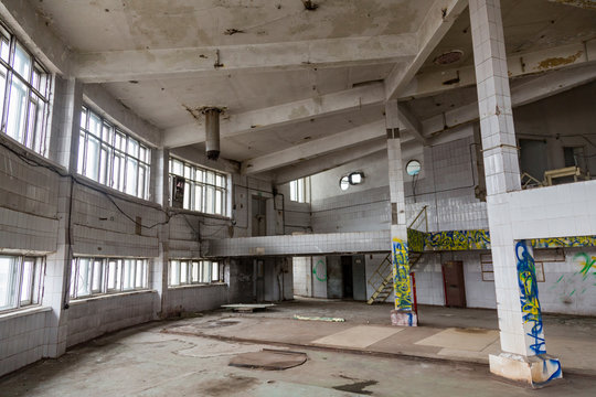 Inside an abandoned deserted cluttered industrial building