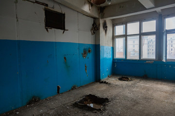Inside an abandoned deserted cluttered industrial building