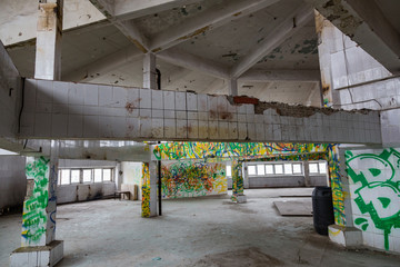 Inside an abandoned deserted cluttered industrial building