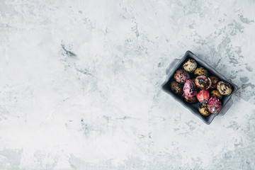 Small coloured Easter eggs. Flay lay. Copy space 