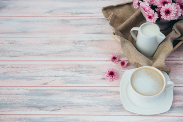 Morning coffee with milk and flowers 