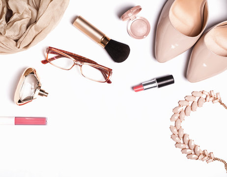 Woman's accessories and cosmetics on the white background