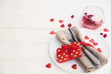Romantig table setting with gift box
