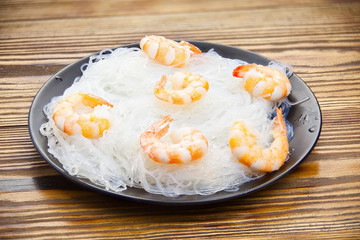 Delicious hot noodles on plate on  table