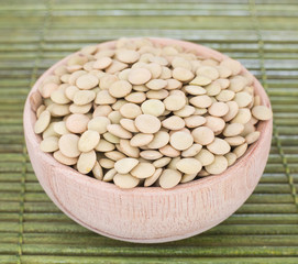Lentils in the wooden bowl (Lens culinaris)