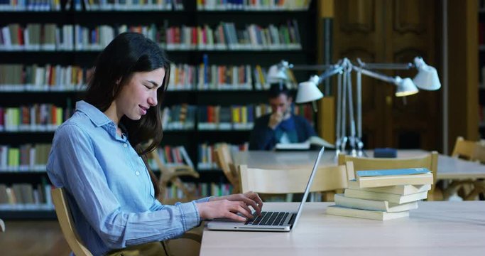 Portraing men and women studying in the library, reading books, or listening to music on the computer in total silence and relaxation. Concept of culture, education, relaxation and study