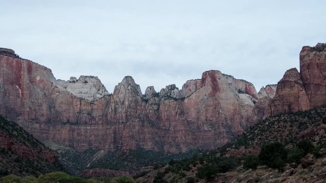 Time lapse in Zion before the sun rises towards tall cliffs