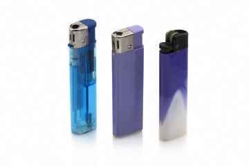 Blue and purple lighters on white background with shadow