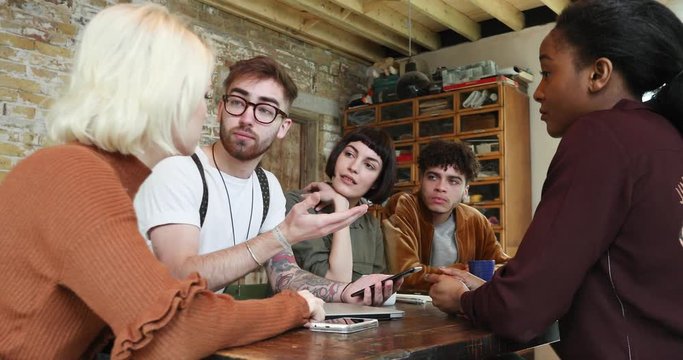 Group of young entrepreneurs working on an app