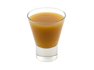 Yellow juice in a glass cup on a white background without shadow