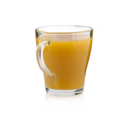 Yellow juice in a glass cup on a white background without shadow