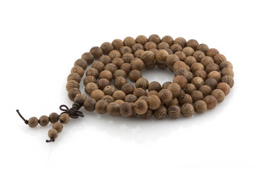 A rosary made of wood on a white background