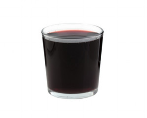 Beet juice in a transparent glass on a white background