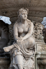 Budapest, Hungary - March 08, 2017: Fragment of neo-renaissance Danubius Water Fountain placed in Erzsebet square since 1959. Women statue symbolise one of the main rivers of the country