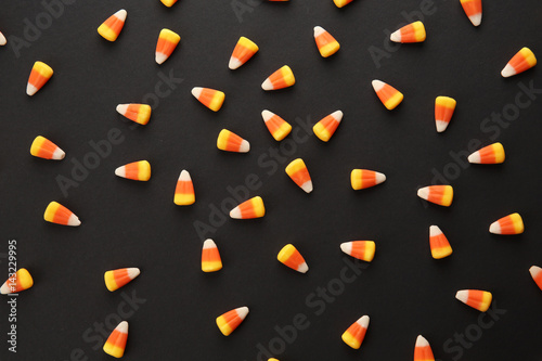 Tasty Halloween candies on dark background