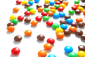 Delicious candies on white background