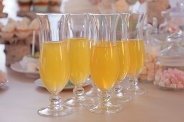 Glasses with juice on table prepared for party