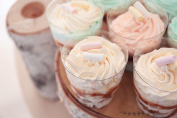 Wooden stand with tasty dessert, closeup