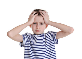 Cute boy suffering from headache on white background